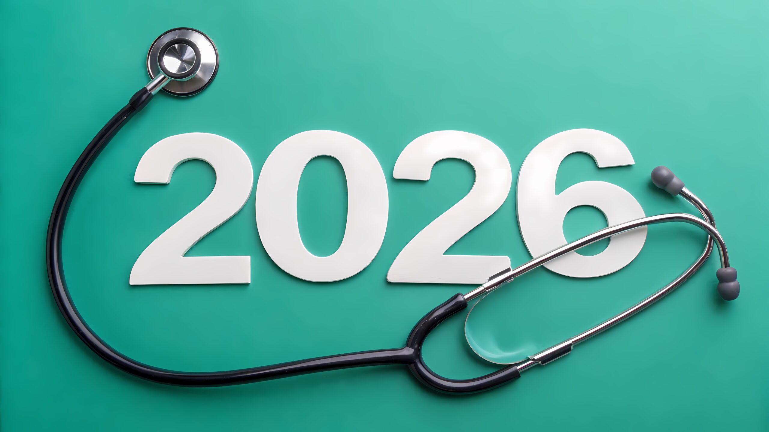 A stethoscope lying on a green surface with the numbers "2026" in large white font.